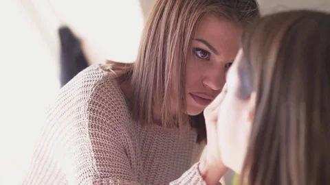 Make-up artist applying makeup Stock Footage 74765430