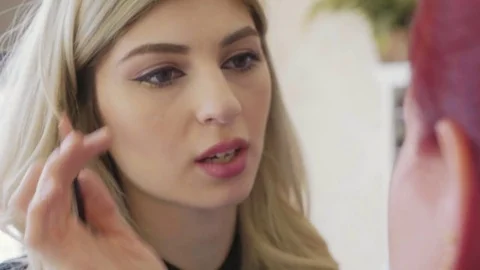 Make-up artist applying makeup to model's eye. Close up view. Stock Footage 82681834