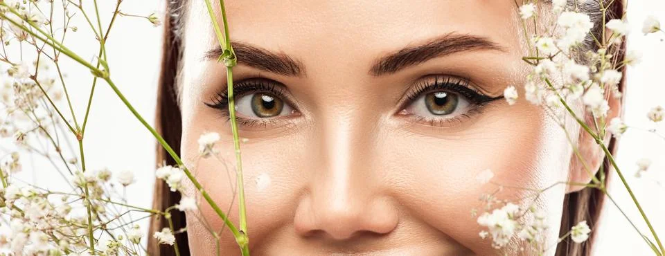 The make-up artist does Long-lasting styling of the eyebrows and makes the .. Stock Photos