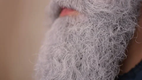 Make-up artist does makeup to a man with a gray beard. Stock Footage 95653555