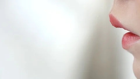 Make-up artist doing make-up of a beautiful young model girl, applies lipstick Stock Footage 73938452