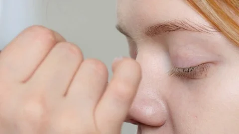 Make-up artist doing make-up of a beautiful model young redhead girl Stock Footage 73939003