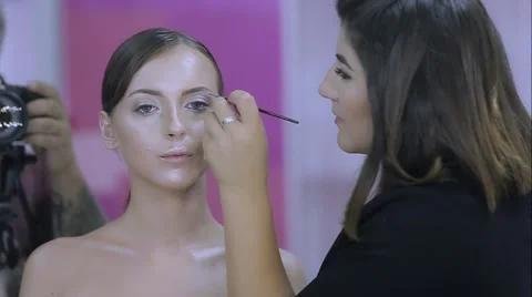 Make-up artist doing make-up girl Stock Footage 67646101