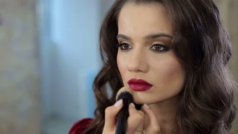 Make-up artist doing make-up for girl in the salon Stock Footage 85249412