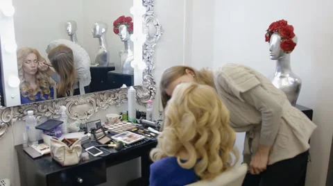 Make-up artist doing make-up model Stock Footage 61058496