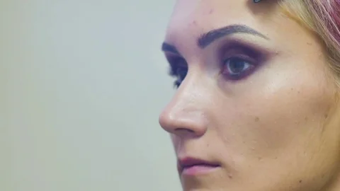 Make-up artist doing make-up powder causes a large brush close-up shot Stock Footage 69784108