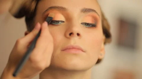 Make-up artist doing make-up before the show models Stock Footage 56704302