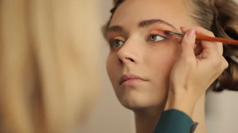 Make-up artist doing make-up before the show models Stock Footage 56711072