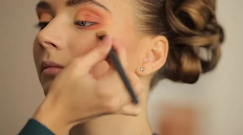 Make-up artist doing make-up before the show models Stock Footage 56711079