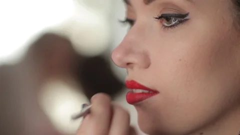 Make-up artist doing models makeup lips Stock Footage 90800365