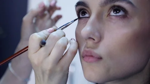 Make up artist doing professional make up Stock Footage 75628614