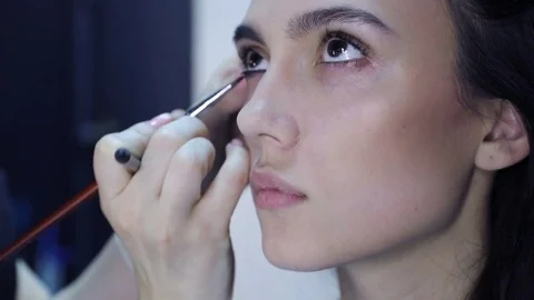 Make up artist doing professional make up Stock Footage 75628839