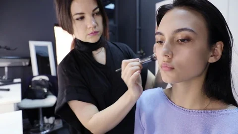 Make up artist doing professional make up Stock Footage 75628874