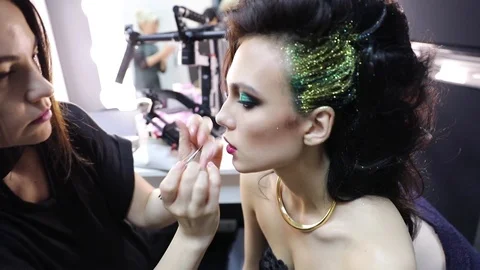Make up artist doing professional make up Stock Footage 75628879