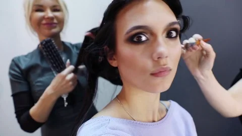 Make up artist doing professional make up Stock Footage 75628880