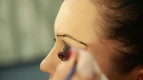 Make-up artist draws eyebrows. Close up Stock Footage 74350213