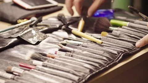Make-up artist folding brushes in their places Stock Footage 85612259