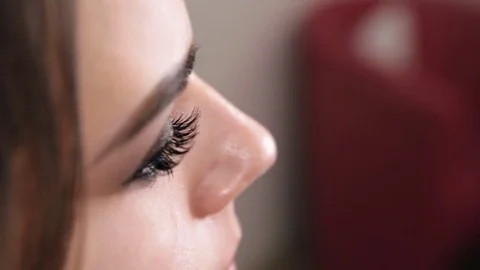 Make-up artist glues false eyelashes Stock Footage 84989166