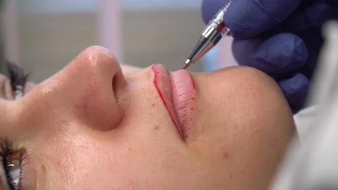 Make up artist makes pencil marks before procedure of permanent lips makeup. Stock Footage 167918792