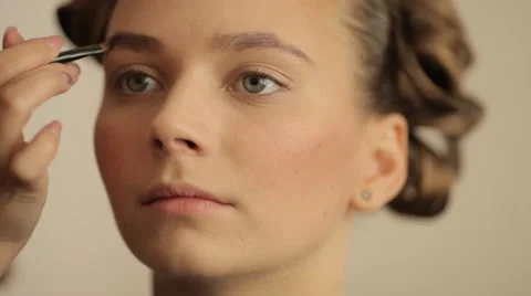 Make-up artist making eye liner to model fashion show Stock Footage 56679045