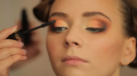Make-up artist making eye liner to model fashion show Stock Footage 56679048