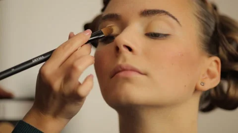 Make-up artist making eye liner to model fashion show Stock Footage 56679072