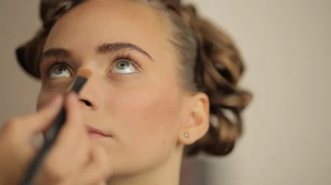 Make-up artist making eye liner to model fashion show Stock Footage 56680421