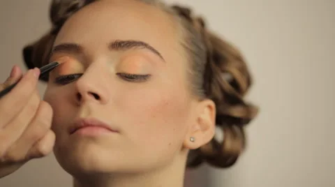 Make-up artist making eye liner to model fashion show Stock Footage 56680430