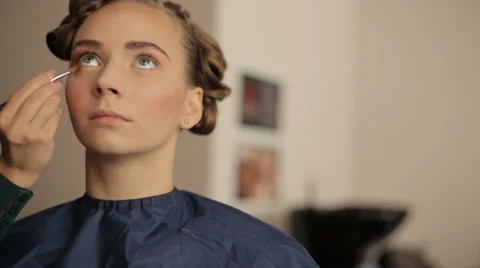 Make-up artist making eye liner to model fashion show Video stock 56680441