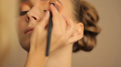 Make-up artist making eye liner to model fashion show Stock Footage 56704350