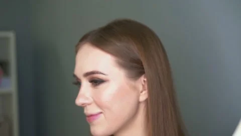 Make-up artist making face correction by brush. Shining eyes, glitters Stock Footage 154964537