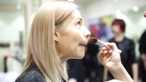 Make up artist making up a young beautiful woman, 4k Stock-Footage 74652278