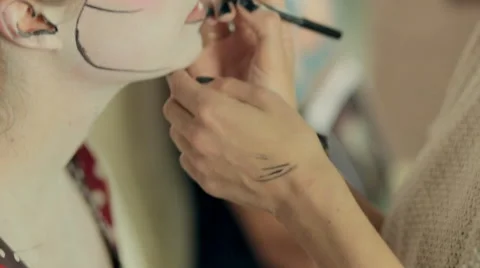 Make-up artist paints elements of the make-up on model, pop art style Stock Footage 54273542