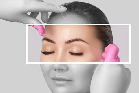 The make-up artist plucks eyebrows with a thread close-up. Face care, beaut.. Stock Photos