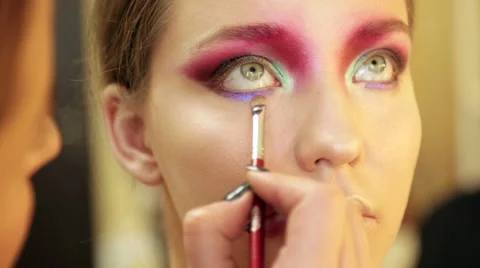 Make-up artist in the process of creating an image Stock Footage 68461718