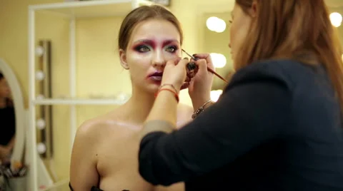 Make-up artist in the process of creating an image Stock Footage 68462339