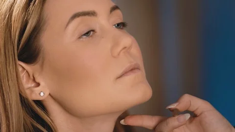 The make-up artist puts bright eye shadow on the eyelids, with a professional Stock Footage 101456211