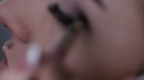 Make-up artist putting on make-up on models eyes. Eye make-up Stock Footage 59868221