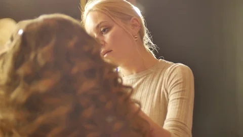 Make-up artist putting on make-up on model's eyes.Eyelids make-up close up shot. Stock Footage 76887090