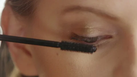 Make-up Artist Putting a Mascara On. Extreme close-up Stock Footage 113677337