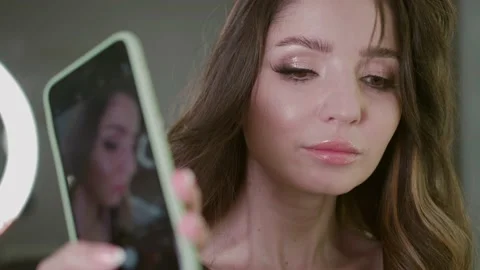 Make-up artist Takes Test shots of the Model, a beautiful Model under the lens 動画素材 132447762