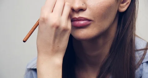 Make-up Artist at work.Eye make-up. Make-up artist putting on make-up on model's Stock Footage 126356659