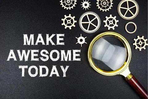 Make Awesome Today text message with magnifying glass on black background Stock Photos