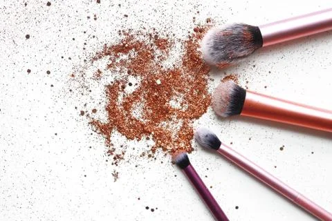 Make-up backdrop with cosmetic brushes and glitter Stock Photos