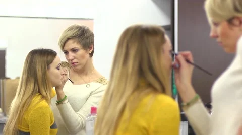 Make-up for beautiful model girl behind the scenes Stock Footage 44474172