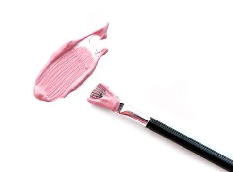 Make up beige foundation with blush on white. Stock Photos