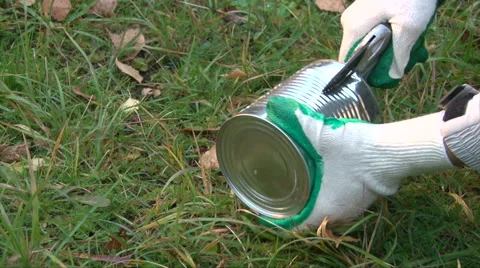 Make a brazier from a can, break the can body into strips Stock Footage 62765465