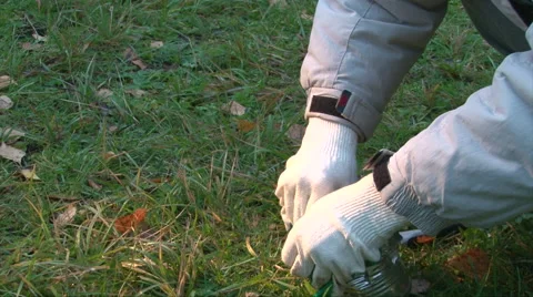 Make a brazier from a can, break the can body into strips and bend it Stock-Footage 62792177