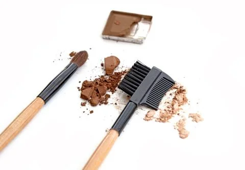 Make up brown eye shadow on white with brush. Stock-Fotos