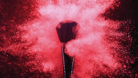 Make up brush and colored powder/particles exploding. Slow Motion. Vidéo 89600616